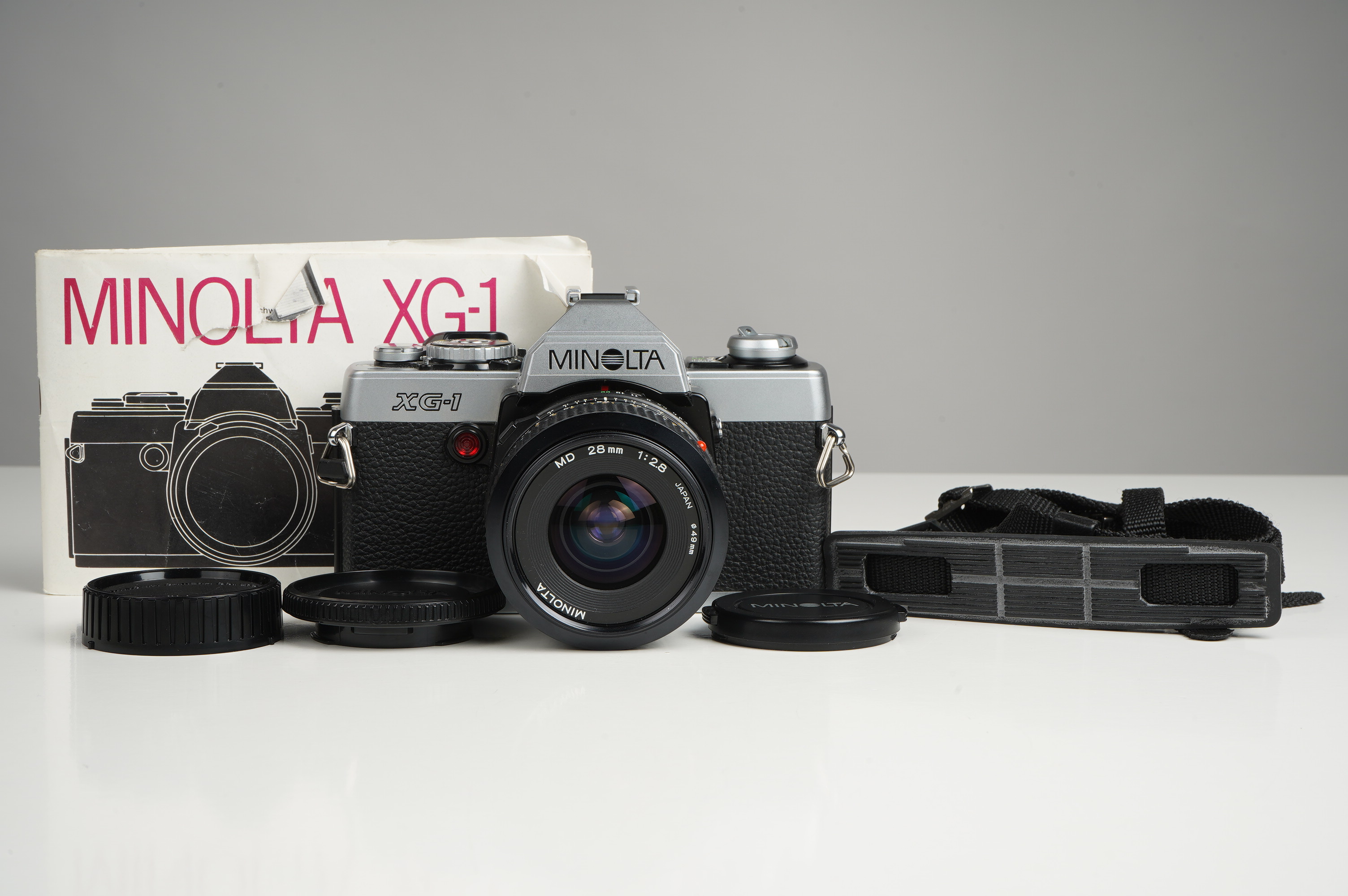 Gebraucht Minolta XG-1 + MD 28mm/2,8  | gut erhalten - kaum Gebrauchsspuren |