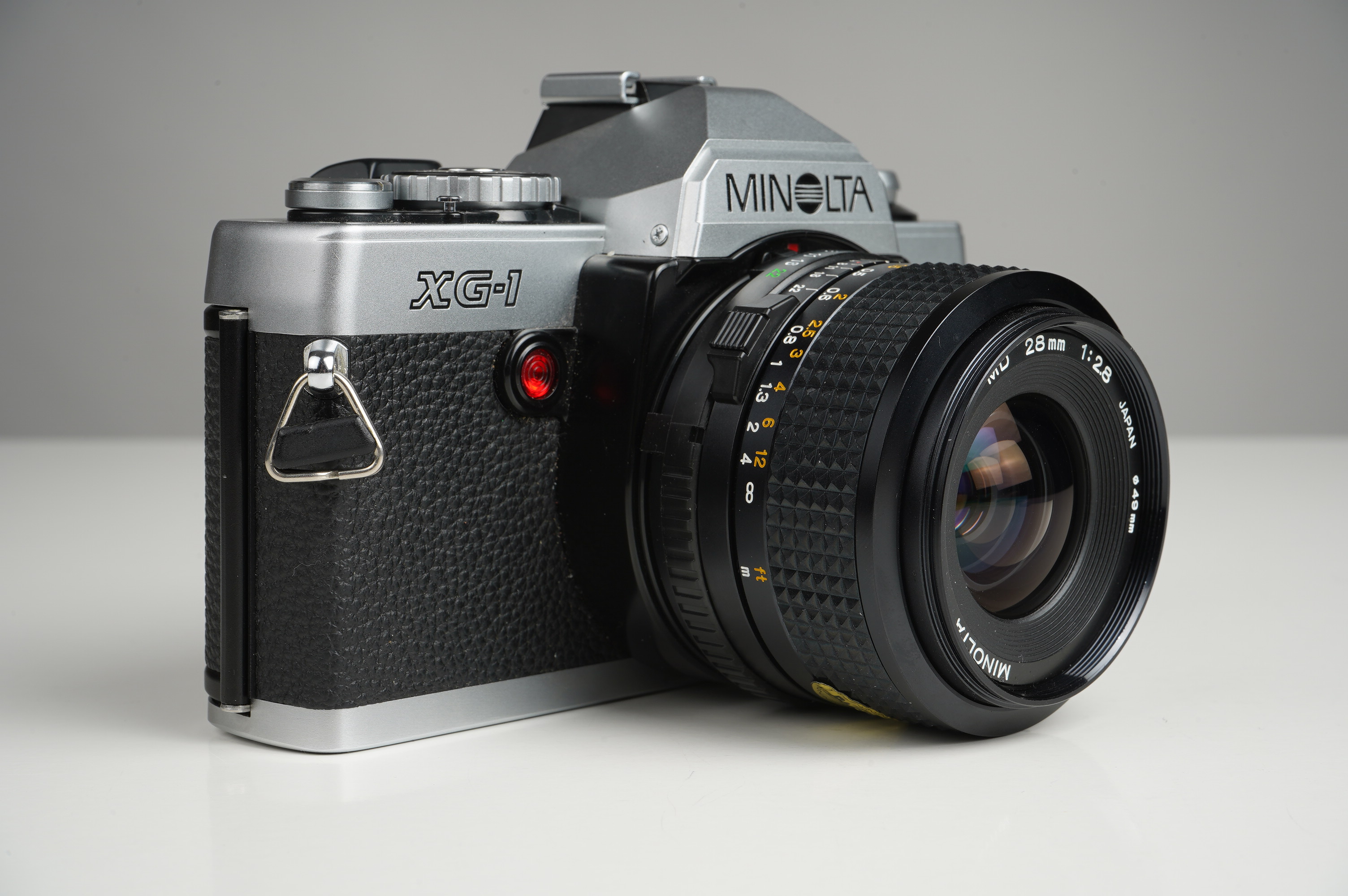 Gebraucht Minolta XG-1 + MD 28mm/2,8  | gut erhalten - kaum Gebrauchsspuren |