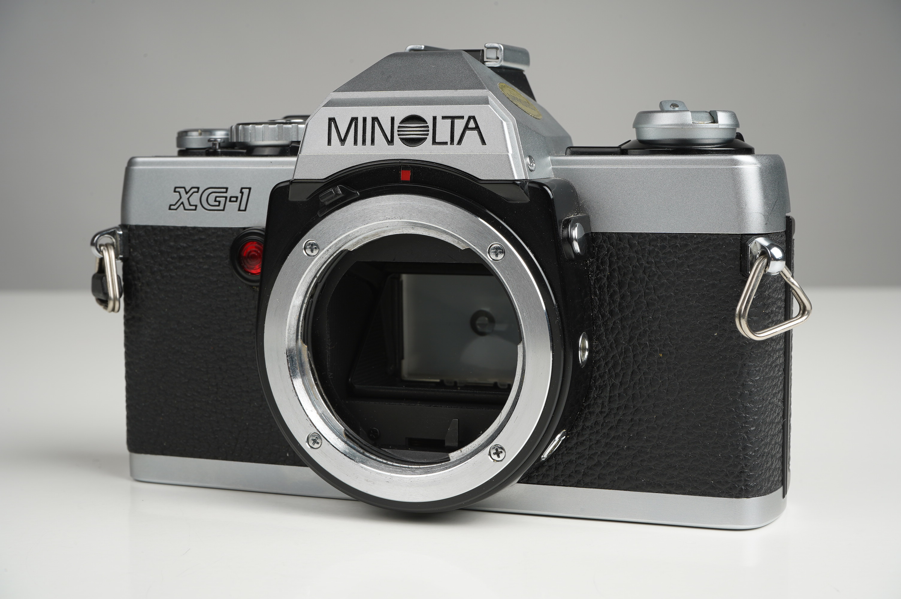 Gebraucht Minolta XG-1 + MD 28mm/2,8  | gut erhalten - kaum Gebrauchsspuren |